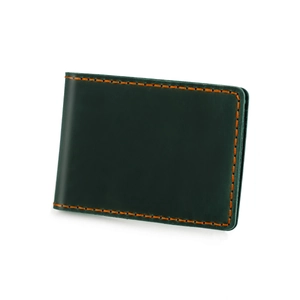 Close-up of deep green vintage leather driver's license holder with orange stitching