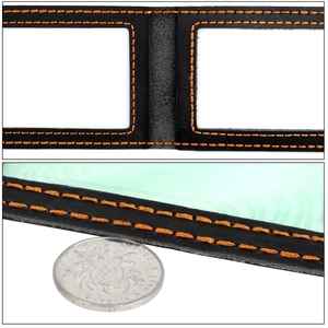 Macro shot of black leather wallet detail with orange stitching and dual PVC windows