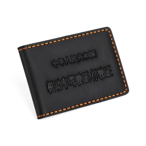 Vintage black faux leather driving license cover with orange stitching in 45-degree view
