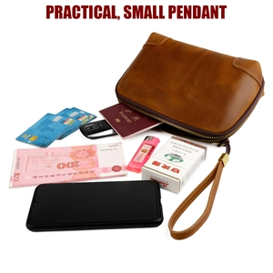 Internal storage detail of brown crazy horse leather clutch showing card slots and compartments