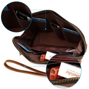 Detail view of vintage leather organizer bag interior with card slots and wrist strap