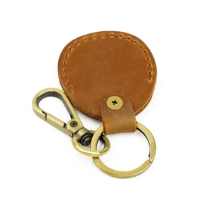 Genuine leather AirTag keychain holder in caramel brown with vintage metal carabiner