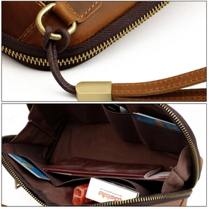 Detailed macro view of vintage leather clutch bag with brass hardware and interior storage