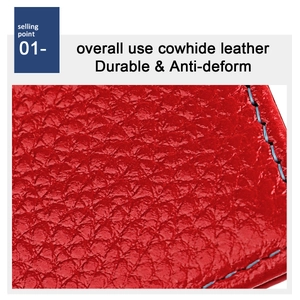 Macro shot of red cowhide leather texture with fine blue stitching and grainy surface