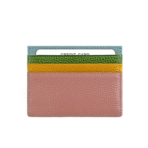 Detail of multi-color genuine leather card holder with four slots and contrast blue stitching
