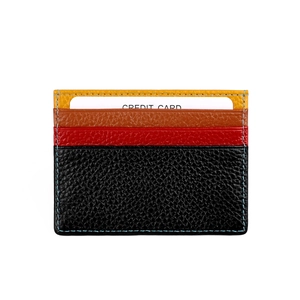 Detail view of multi-color lychee pattern leather card holder with blue stitching