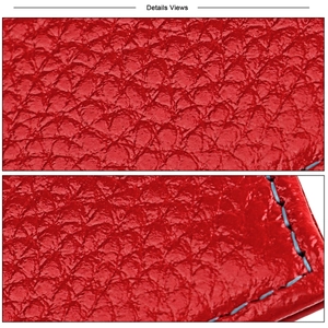 Detail of red pebbled leather wallet showing grain texture and blue contrast stitching