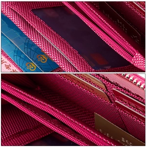 Détail d'un portefeuille long rose avec fentes pour cartes RFID et fermeture éclair en métal