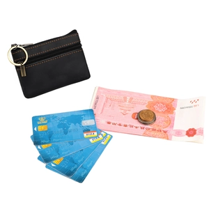 Detail of black leather coin purse with double zippers, orange stitching, and key ring