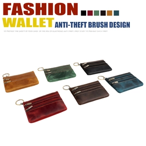 Detail of RFID-blocking vintage leather coin purse with triple zippers and metal key ring