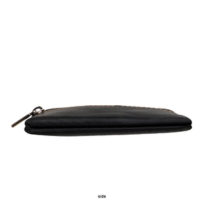 Side view of black genuine leather coin purse with orange stitching and vintage metal zipper