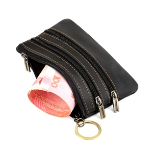 Detail of black crazy horse leather wallet with triple zippers and orange contrast stitching