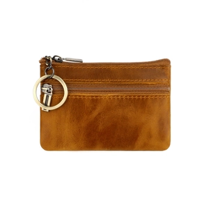 Macro view of caramel brown vintage leather wallet with dual zipper compartments and ring