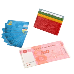 Slim multi-color leather card holder with four slots and a pebble grain finish