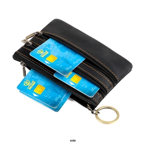 Detail of black crazy horse leather card holder with three zippers and gold key ring