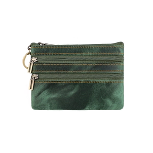 Detail of crazy horse leather coin purse with three zippers and metal key ring in green