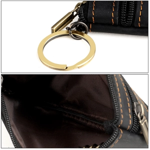 Detail view of crazy horse leather key pouch with orange stitching and dual zipper closure