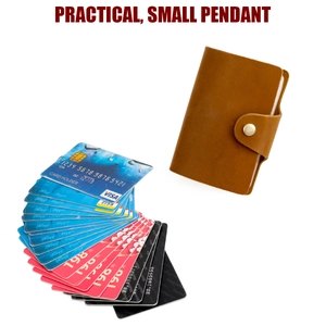 Detail of vintage brown leather slim wallet showing card slots and golden snap button