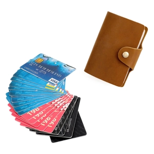 Detail view of vintage crazy horse leather card holder with secure metal snap closure