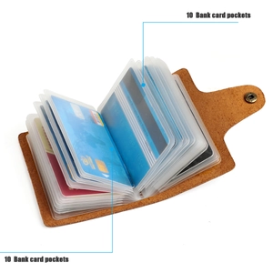 Detail of vintage brown leather card holder featuring ten clear slots for bank cards
