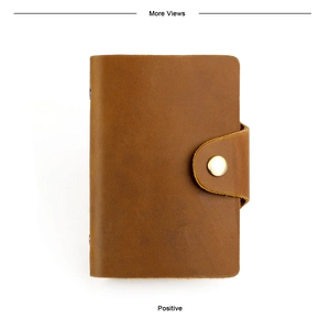 Front view of crazy horse leather card holder with snap closure and fine stitching