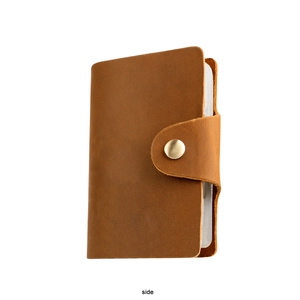 Side view of brown crazy horse leather card holder with clear slots and snap closure
