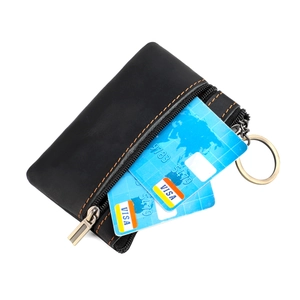 Vintage black leather coin purse with orange stitching and bronze zipper closure