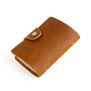 Vintage brown crazy horse leather card holder with bronze snap button closure and rivets