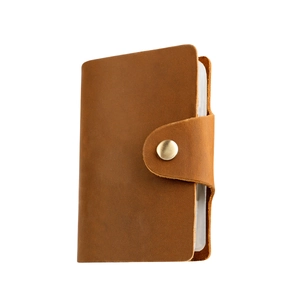 Vintage brown crazy horse leather card holder with secure metal snap button closure