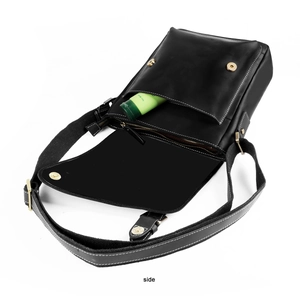 Macro view of black crazy horse leather messenger bag with white contrast stitching