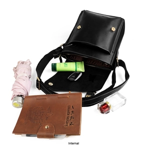 Interior view of black leather crossbody bag showing large capacity for daily items