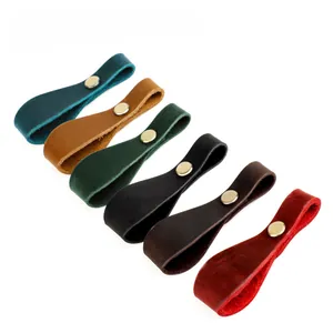 Detail view of crazy horse leather keychains in six colors with gold snap buttons