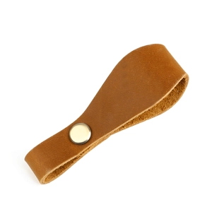 Macro shot of crazy horse leather keychain with silver snap button on white background