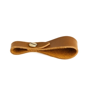 Detail of crazy horse leather strap loop with a solid brass screw for outdoor gear