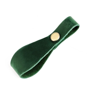 Detail of dark green crazy horse leather strap with a metallic gold snap button