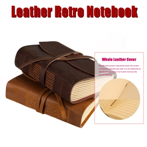 Macro detail of handmade crazy horse leather notebook featuring hand-stitched binding