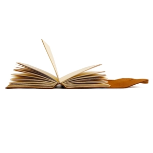 Detailed side view of vintage leather notebook showing thick multi-layer hand-stitched binding