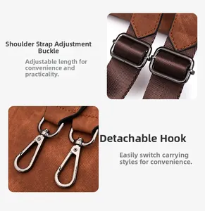 Detail of adjustable wide shoulder strap with dark grey metal buckle and swivel hook