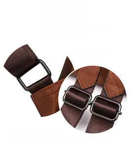 Detail of adjustable brown woven shoulder strap with metallic buckle and leather reinforcement