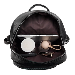 Detailed top view of a black PU leather backpack showing large interior storage space