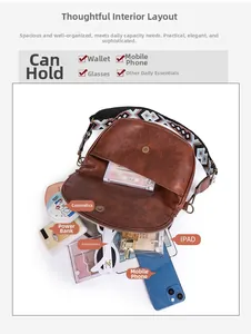 Detail view of brown vintage crossbody bag with spacious multi-compartment interior