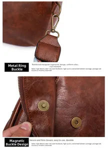 Detailed view of vintage brown lychee leather texture with bronze metal hook and magnetic clasp