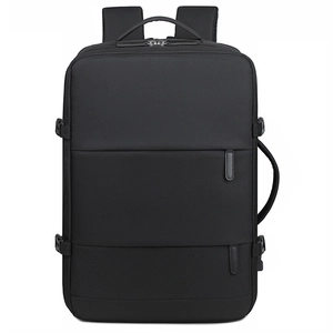 Detail of multi-compartment travel backpack with side compression straps and waterproof fabric
