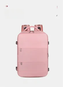 Front view of pink travel backpack featuring multiple zippered pockets and adjustable straps