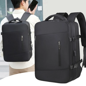 Detail of waterproof business backpack showing external USB charging port and buckles