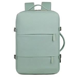Detail of mint green travel backpack showing water-resistant fabric and side buckles