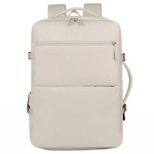 Detail view of large beige travel backpack with reinforced buckles and side carry handle