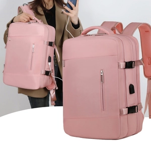 Pink waterproof laptop backpack with USB port and multiple zipper pockets for travel