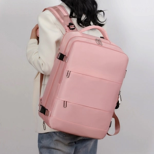 Pink large capacity business travel backpack with waterproof fabric on a model