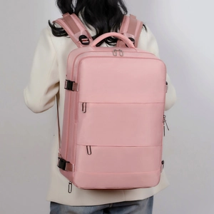 Rear view of a pink large capacity waterproof backpack showing shoulder straps and structure